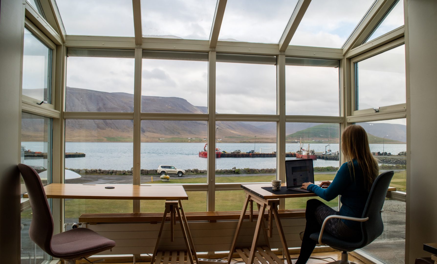 woman working remotely from her own desk